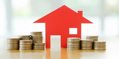 house cutout with coins